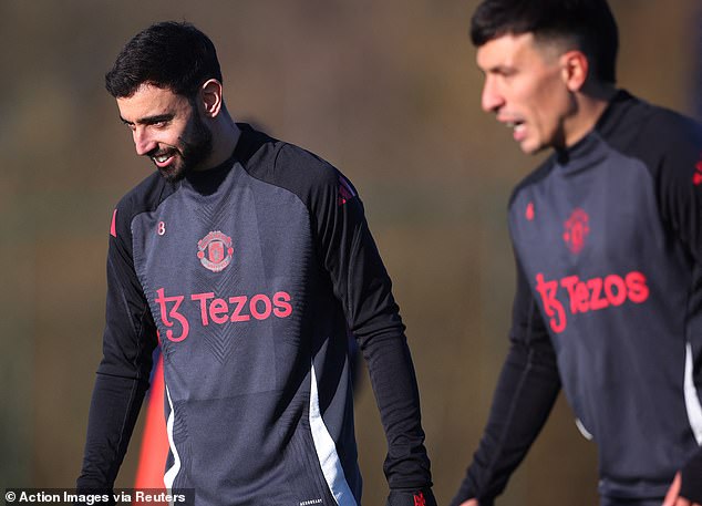 Lisandro Martinez (right) was back in training today providing a huge boost for Man United