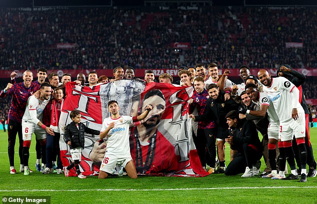 Jesus Navas' team-mates raised a flag in tribute to his 18-season long career with Sevilla