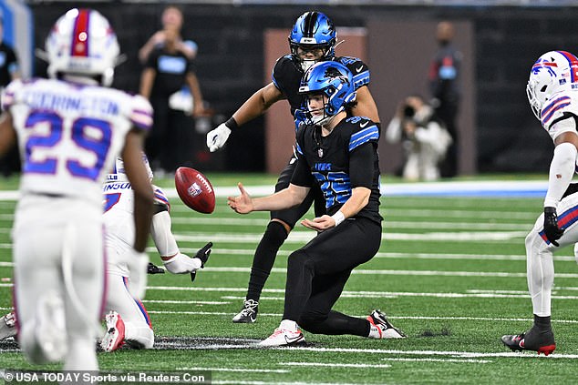 Detroit Lions place kicker Jake Bates (39) attempts to recover his own onside kick on Sunday