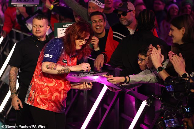 Van Leuven took a while to get to the stage as she signed autographs for fans during walk-on