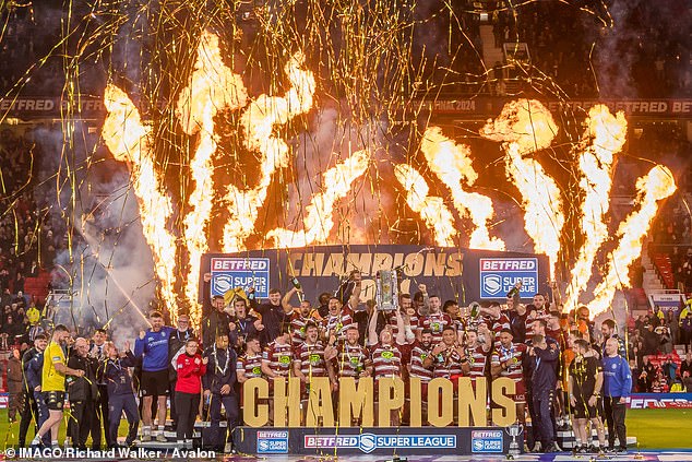 Rugby club Wigan Warriors walked away with the Team of the Year title last night (pictured: Wigan Warrior Champions post match celebrations following their Super League win)