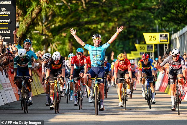 Britain's Mark Cavendish celebrating as he crosses the finish line during the third Tour de France where he broke a record this year