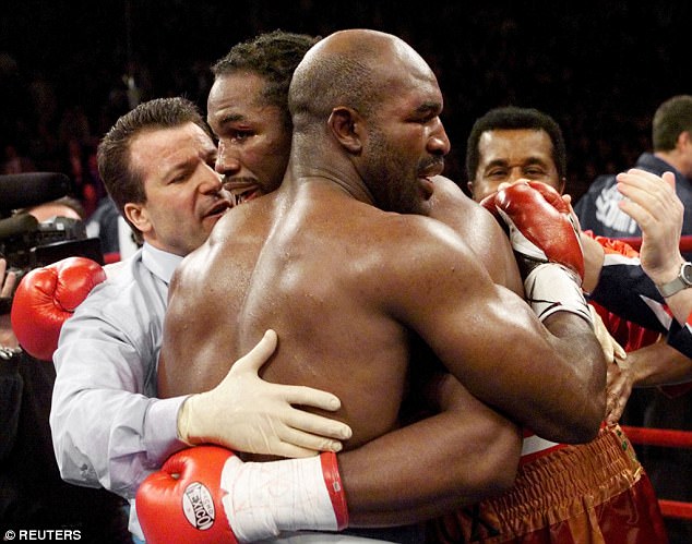 Lewis and Holyfield embrace at the final bell. The Briton won their rematch seven months later