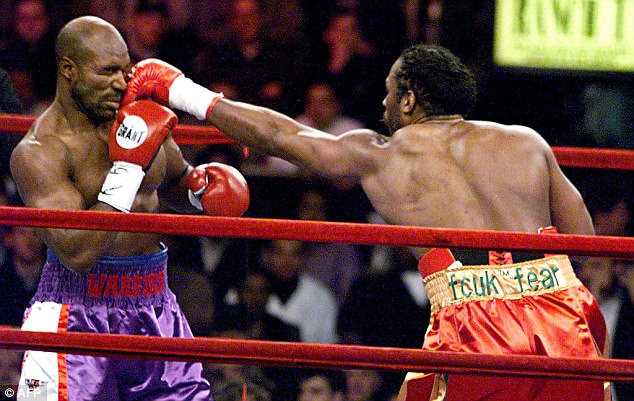 Evander Holyfield (L) predicted a third-round victory but Lennox Lewis dominated early on