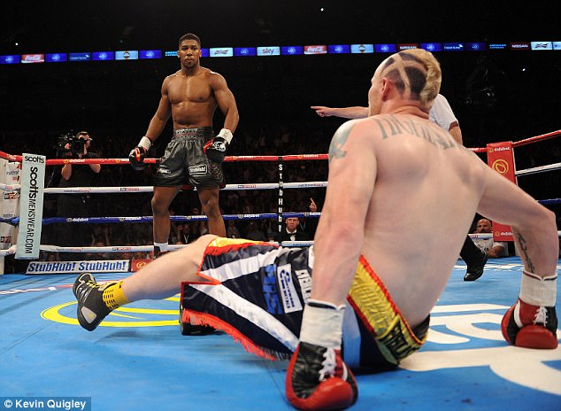 Gary Cornish hits the canvas and is one of Joshua's 18 opponents to suffer a knock-out defeat