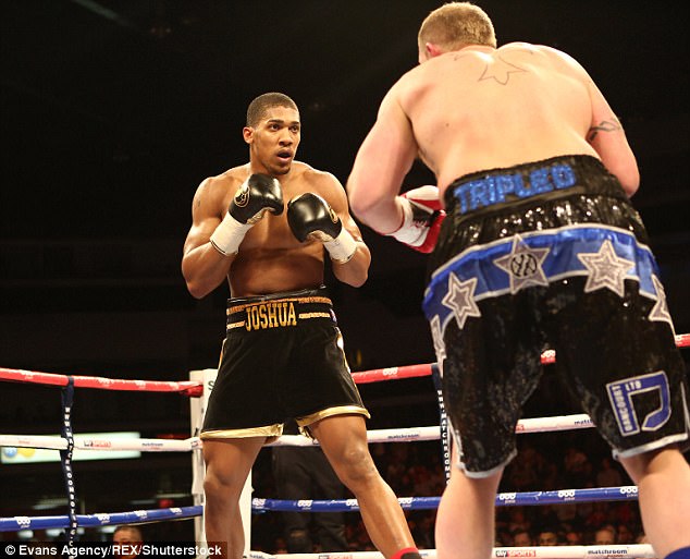 Joshua looks into the eyes of Dorian Darch during his second-round stoppage in February 2014