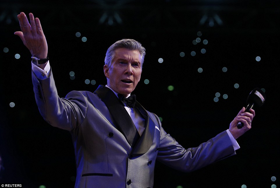 World renowned announcer Michael Buffer works the crowd ahead of Anthony Joshua's entrance 