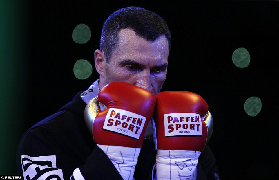 Klitschko kisses his gloves while he waits for Anthony Joshua to make his entrance on Saturday evening