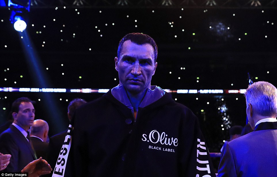 Klitschko cuts an imposing figure as he makes his way through the crowd and towards the ring