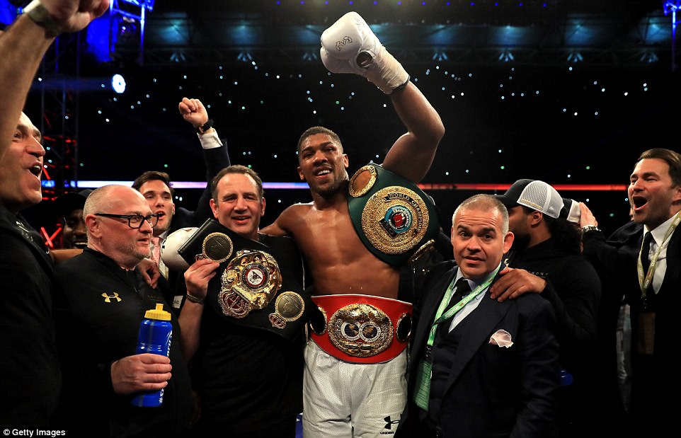 The Olympic champion added the IBO and WBA heavyweight titles to the IBF belt he already held ahead of the fight