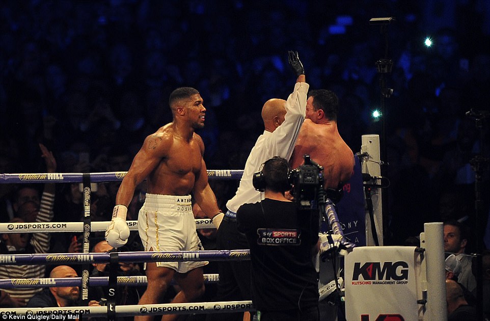 Referee David Fields steps between the two fighters during Saturday's nights brutal contest at Wembley