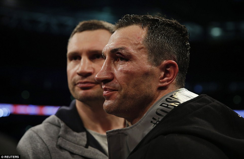 Wladimir Klitschko is consoled by his brother Vitali after suffering the second successive defeat in his professional career