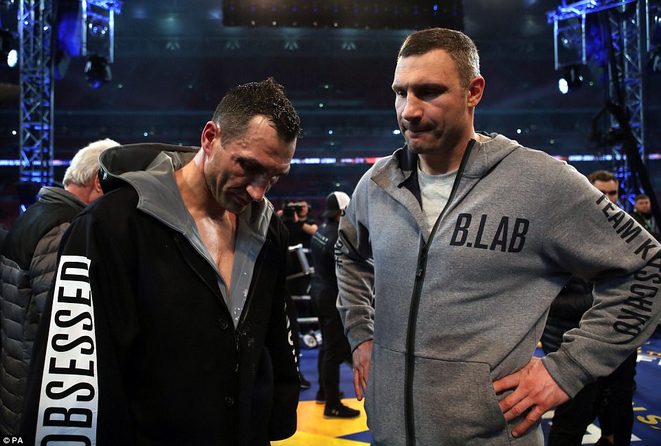 But there were contrasting emotions for the Klitschko brothers Wladimir (left) and Vitali as the dust settled at Wembley