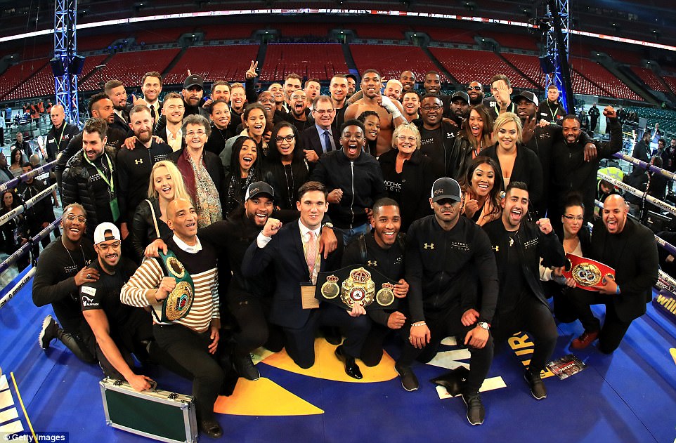 Joshua celebrates with his friends and family in the small hours at Wembley Stadium following an incredible night