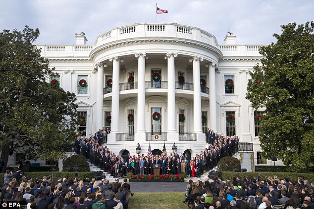 Reform: President Trump with Republican members of the House and Senate following the passing of the tax bill 