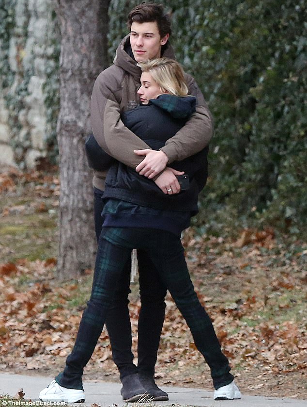 Happy lady: At one point they stopped walking so they could hug on the street. Hailey closed her eyes to enjoy the sweet embrace