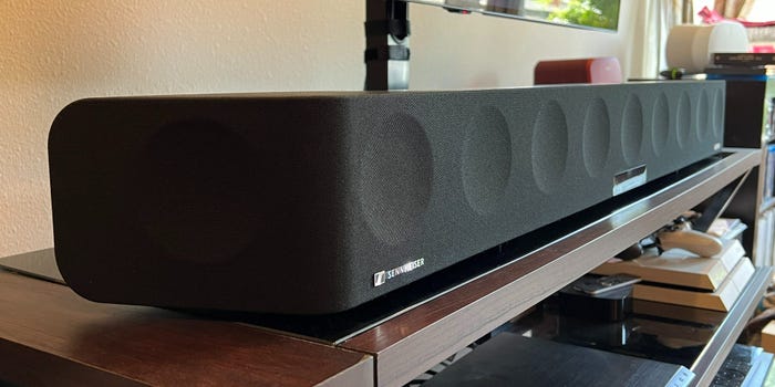 A Sennheiser Ambeo Max soundbar resting on an entertainment console.