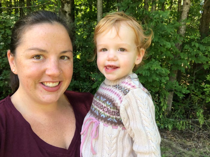 Mom and toddler posing for photo