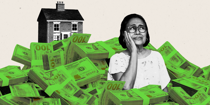 woman anxious in a pile of money with a house on top.