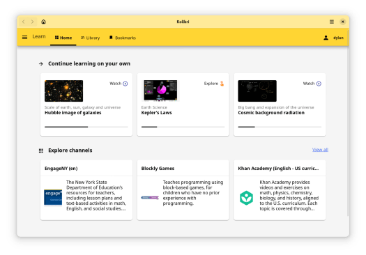 A screenshot of the Kolibri GNOME app. It is showing the Learn / Home page, which includes several items arranged in a grid. At the top, "Continue learning on your own (Watch)", followed by "Hubble image of galaxies (Explore)", "Kepler's Laws", and "Cosmic background radiation (Watch)". Next, "Explore Channels", with three channels visible: "EngageNY", "Blockly Games", and "Khan Academy".