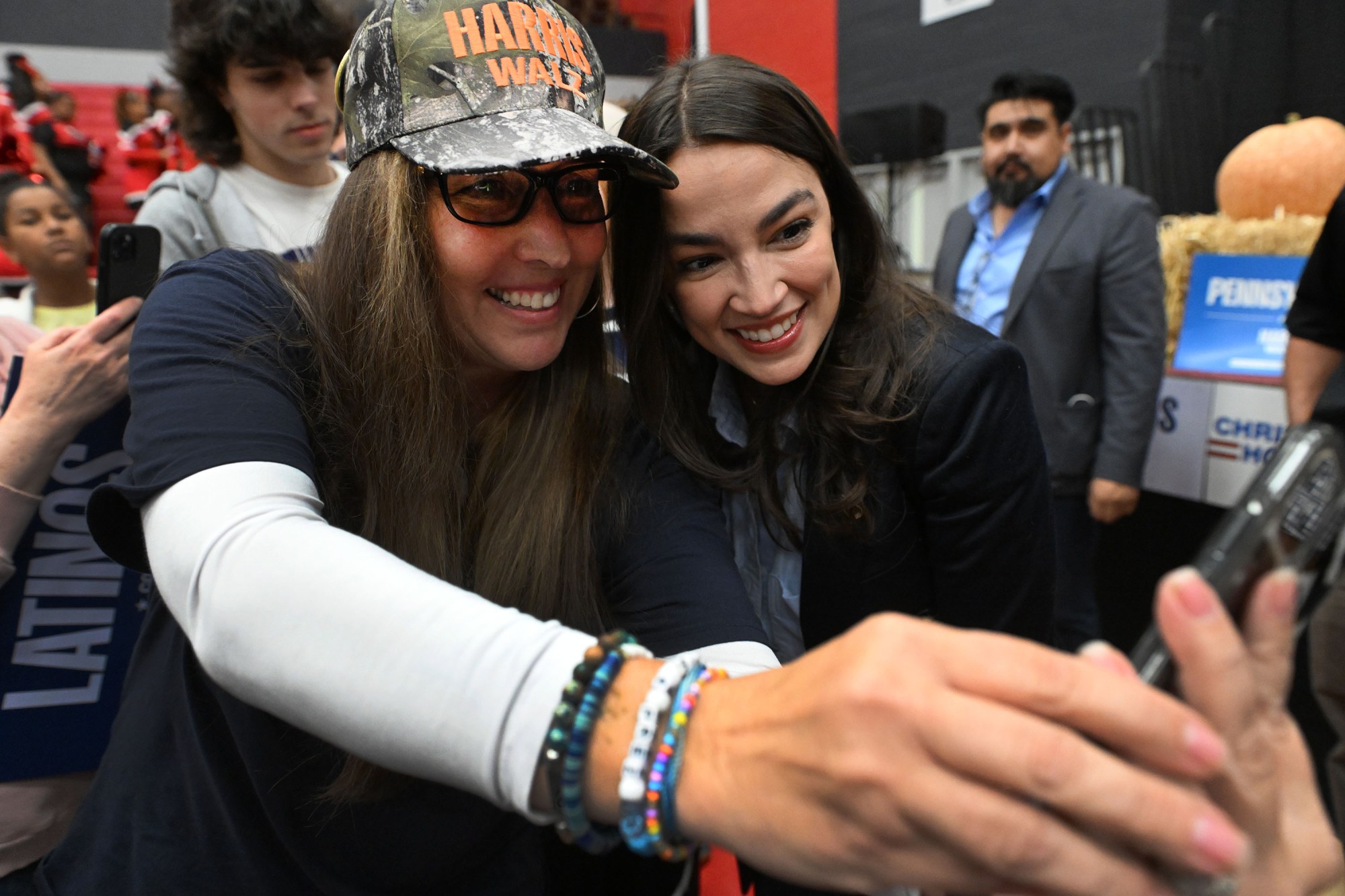 U.S. Rep. Alexandria Ocasio-Cortez poses for a selfie with an attendee of a rally of Reading and Berks Democrats on Saturday at the Geigle. (BILL UHRICH/READING EAGLE)