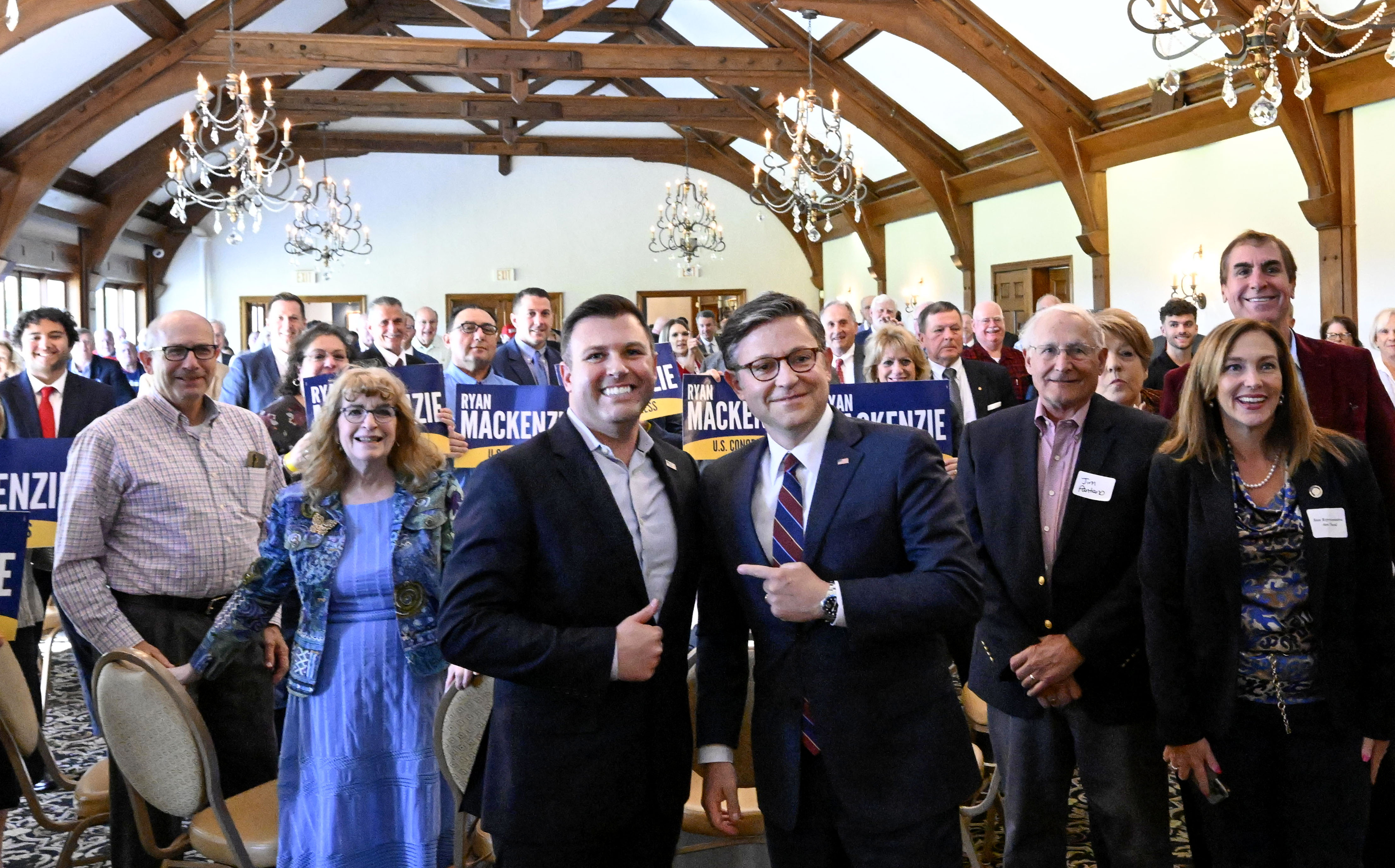 Speaker of the House Mike Johnson and Republican congressional candidate state Rep. Ryan Mackenzie stand for a photo Thursday, Oct. 10, 2024, with a room full of Mackenzie supporters at the Steel Club in Lower Saucon Township. Mackenzie is challenging Democratic U.S. Rep. Susan Wild for the 7th Congressional District seat. (Monica Cabrera/The Morning Call)