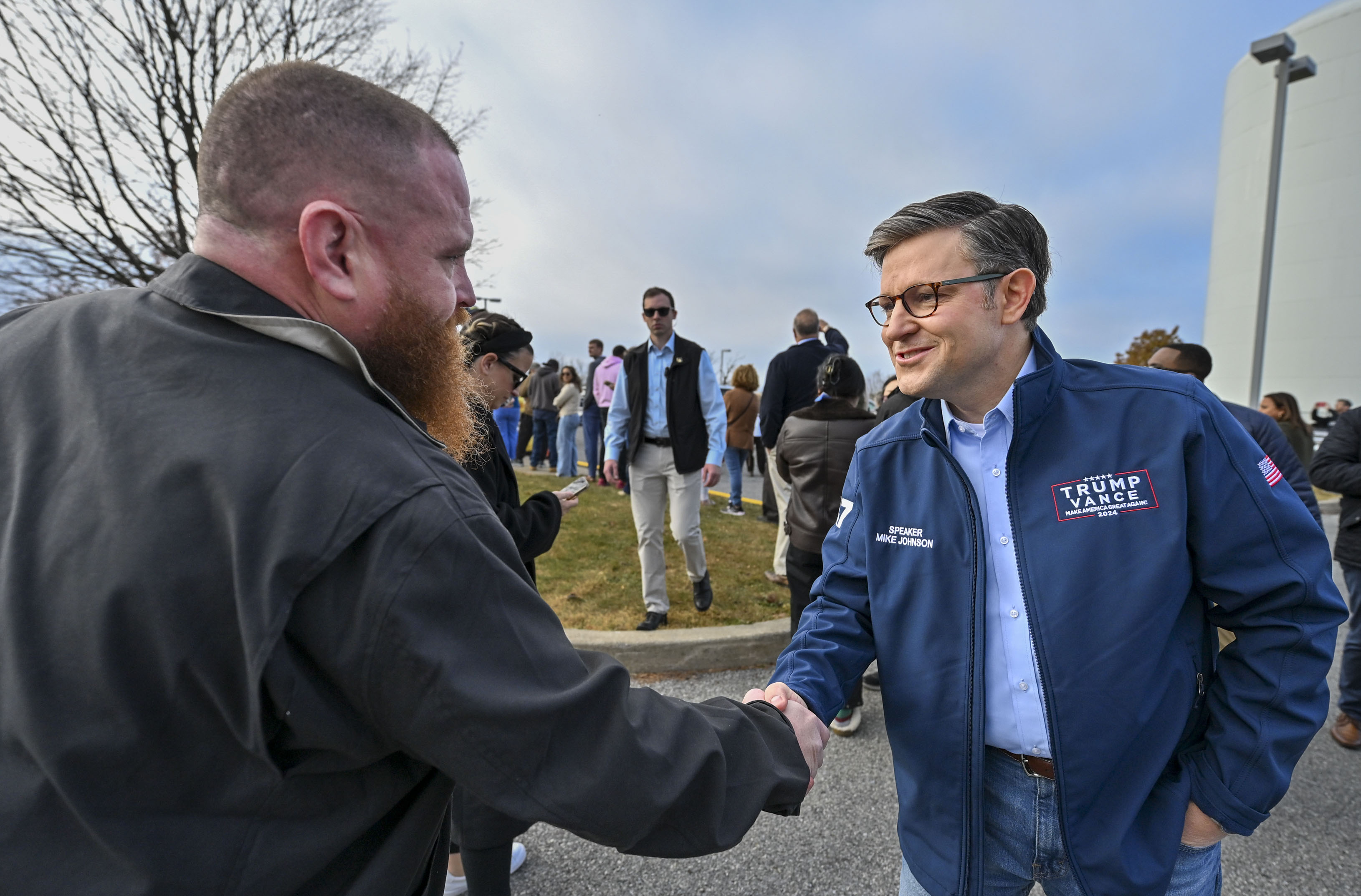 U.S. Speaker of the House Mike Johnson talks to voters and shakes Ed Fox's hand as he waits to vote Tuesday, Nov. 5, 2024, at Farmersville Elementary School in Bethlehem Township.(April Gamiz/The Morning Call)