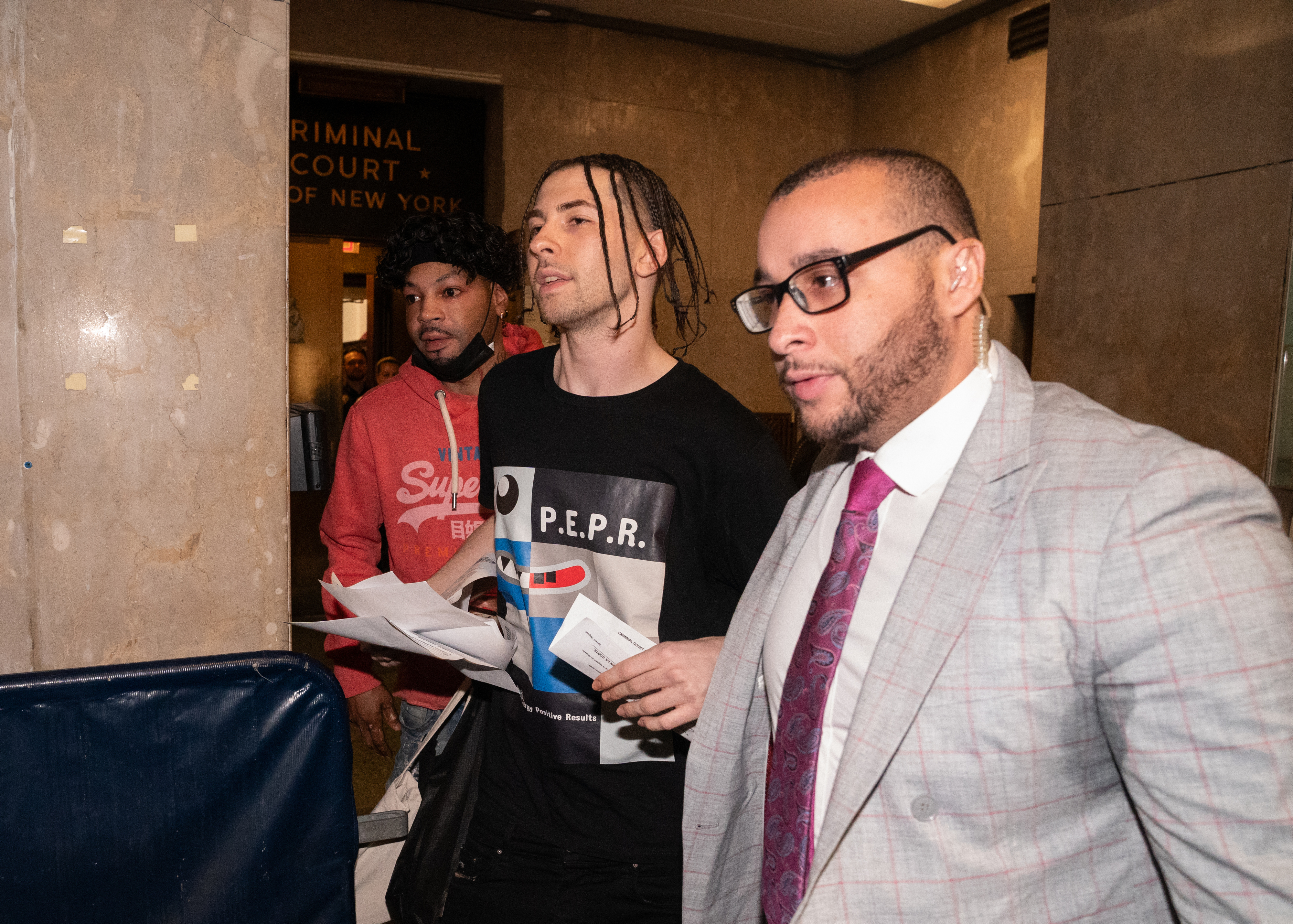 Declyn Lapuper is escorted by his personal security out of Manhattan Criminal Court after making bail for a gun possession charge Friday, Feb. 9, 2024 in Manhattan, New York. (Barry Williams for New Daily News)