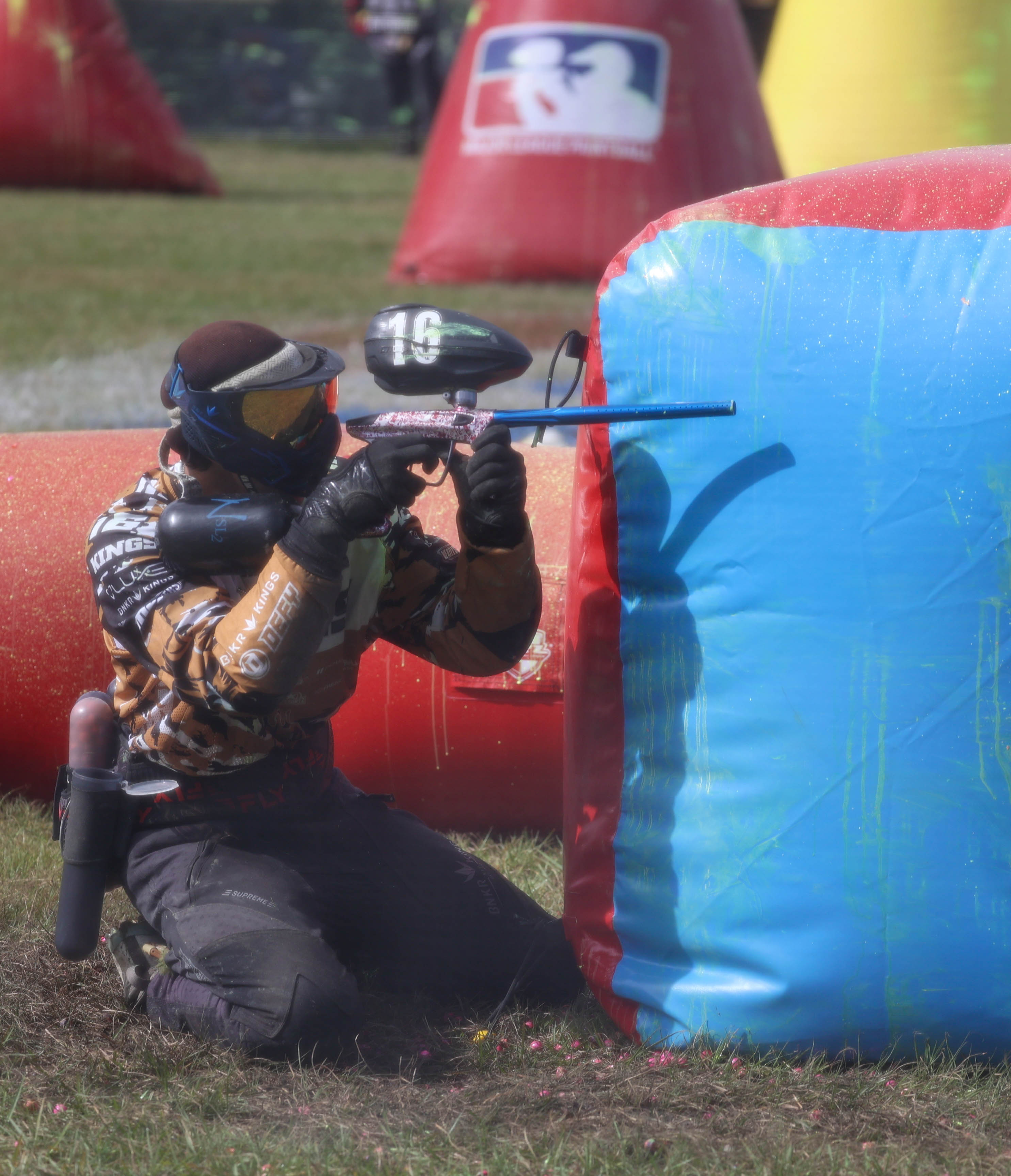 A member of MLKings takes cover and aims during a pro-level prelim match at the NXL World Cup of Paintball tournament in Kissimmee on Thursday, Nov. 7, 2024. (Rich Pope, Orlando Sentinel)