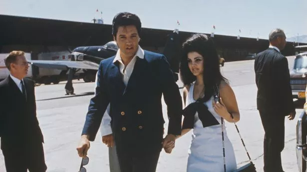 Priscilla Presley and Elvis Presley pictured at an airport during their honeymoon