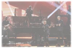 Billy Joel performing at the 66th GRAMMY Awards