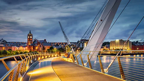 Illuminated 'Peace Bridge' over the River Foyle in Derry (Credit: Getty Images)