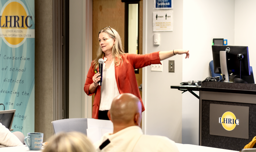 woman speaking at podium during conference