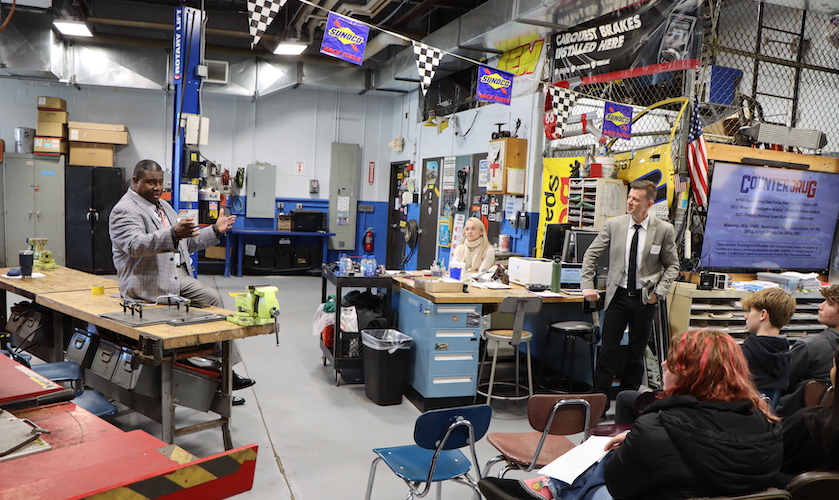 career conference session in auto garage