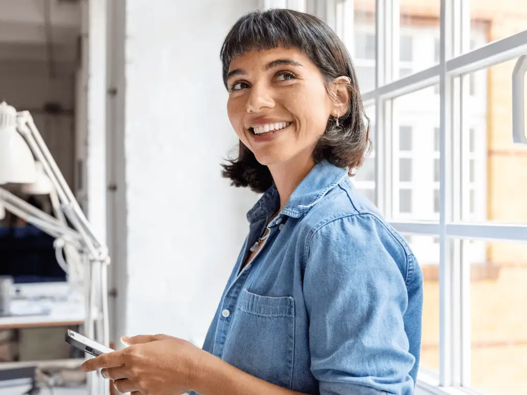 A woman holding a mobile phone