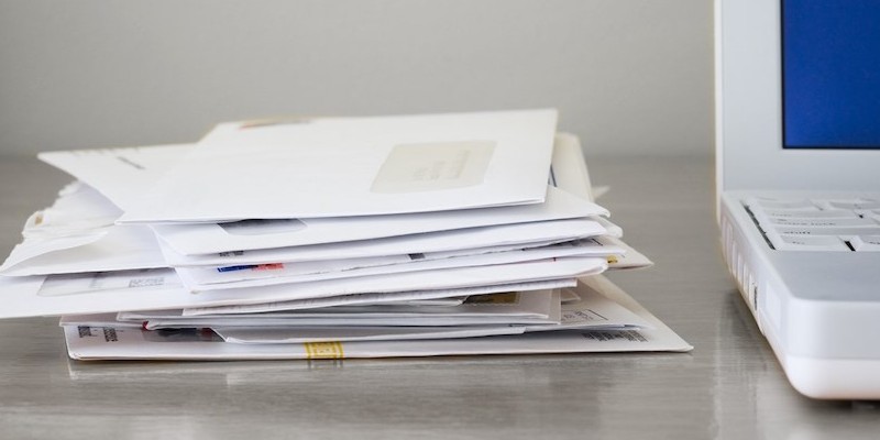 mail letters stack on desk