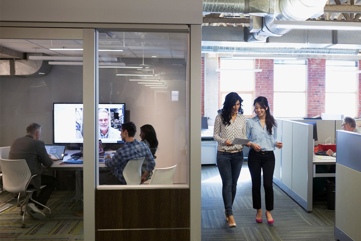 Women walking in office