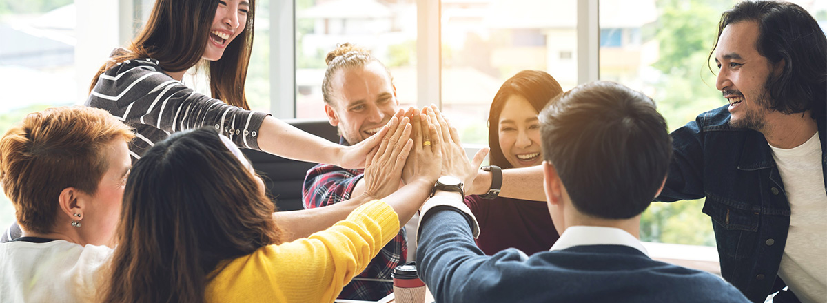 Group of people doing a "high five"