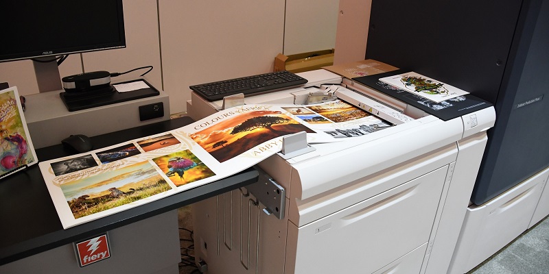 Xerox Iridesse Production Press with print samples on extra long paper