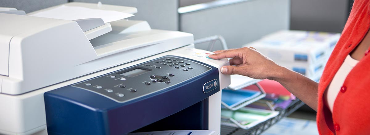 Woman using a Xerox MFP