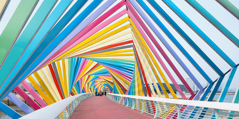 people on bridge color roof