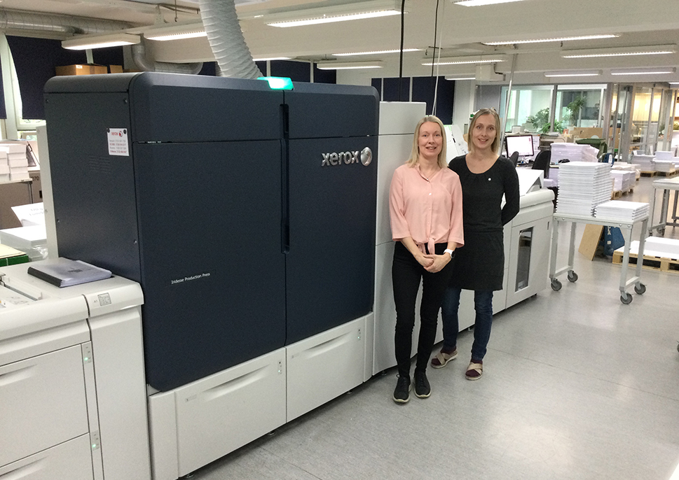 Erja Kiviranta, President of Picaset Oy, with their Iridesse Press