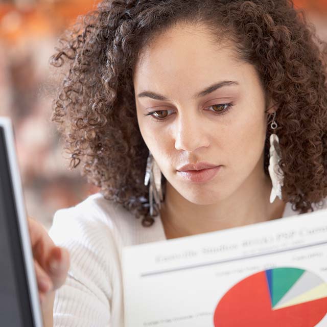 Woman looking at report