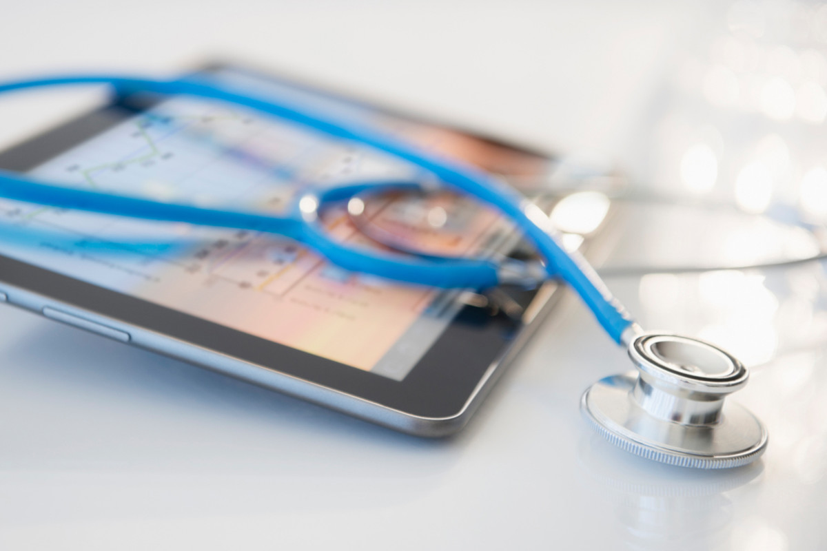 Stethoscope sitting on a tablet