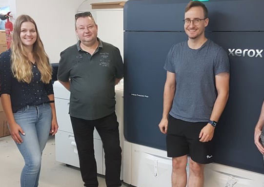 Employees from City Druck Erfurt with their Xerox Iridesse Press