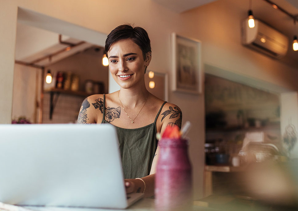 Woman working on a laptop at home