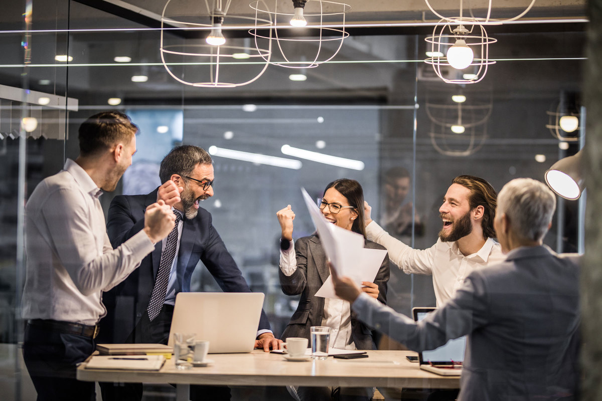 A team of coworkers celebrating