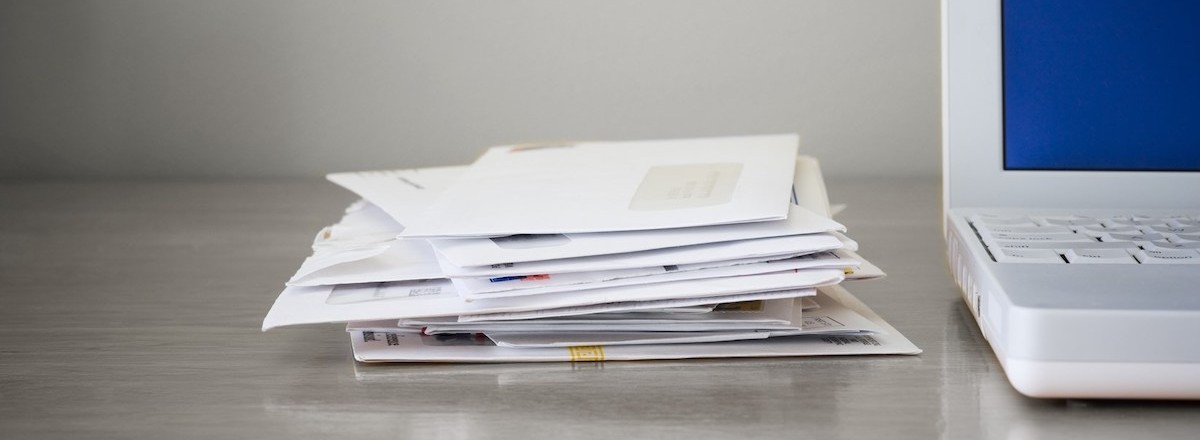 mail letters stack on desk