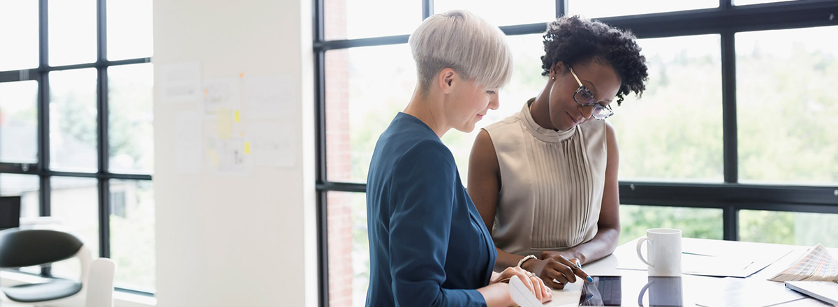 Two women working at a table