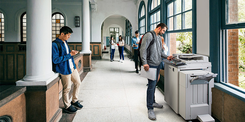 Man printing from a print kiosk.